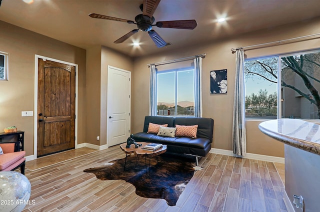 sitting room featuring recessed lighting, baseboards, ceiling fan, and wood tiled floor