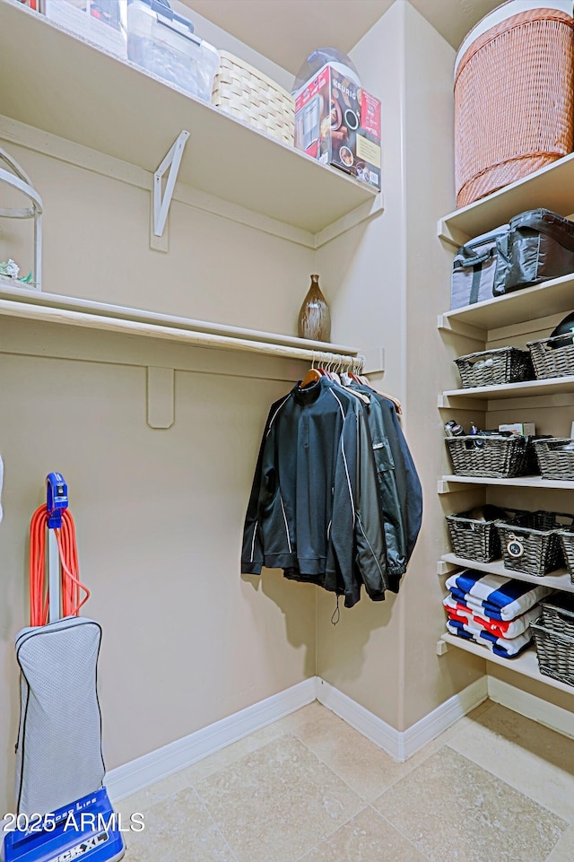 walk in closet featuring tile patterned flooring