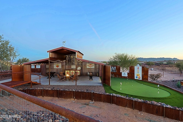 back of house with a patio and fence