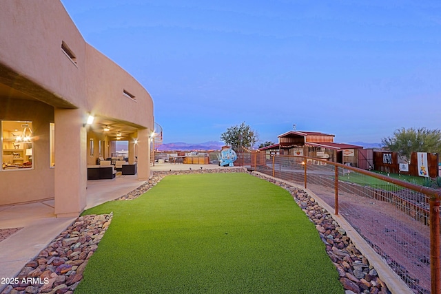 view of yard featuring a patio and fence