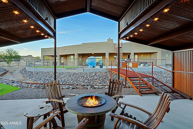 view of patio with fence and an outdoor fire pit