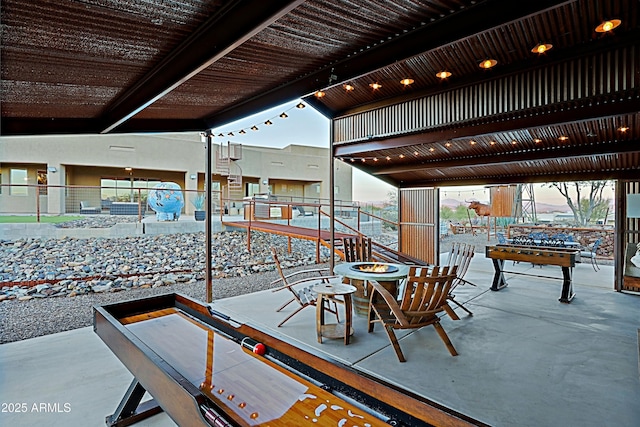 view of patio with an outdoor fire pit