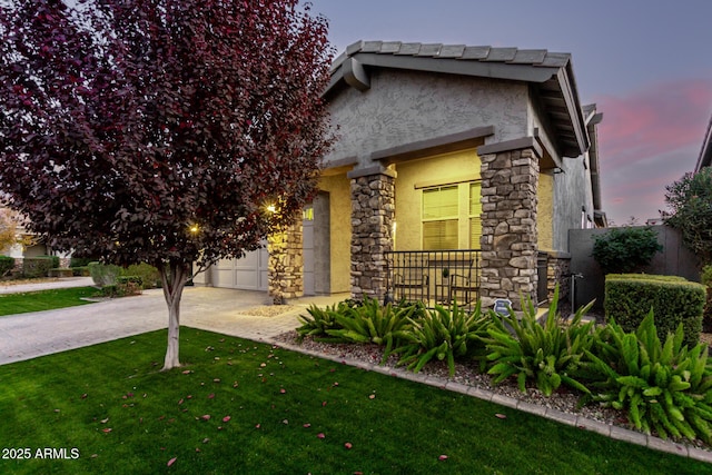 view of front of property with a lawn