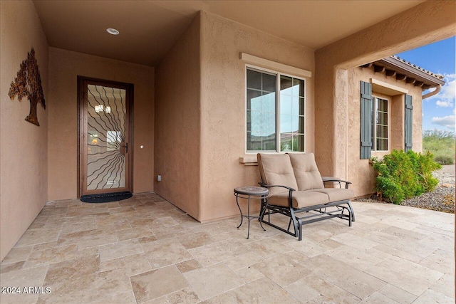 property entrance with a patio area