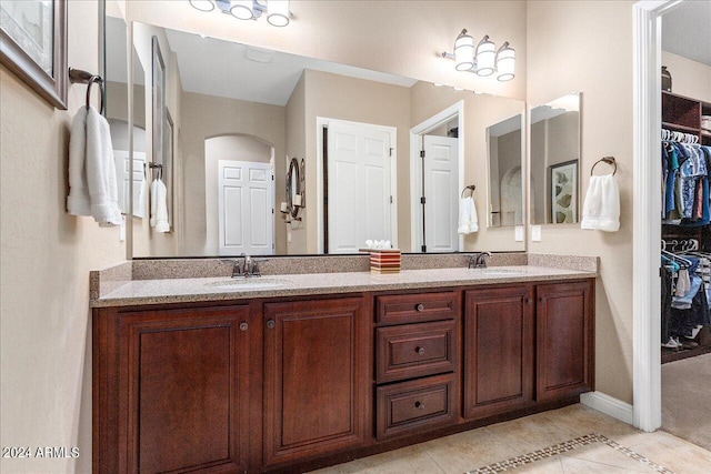 bathroom with tile patterned flooring and vanity