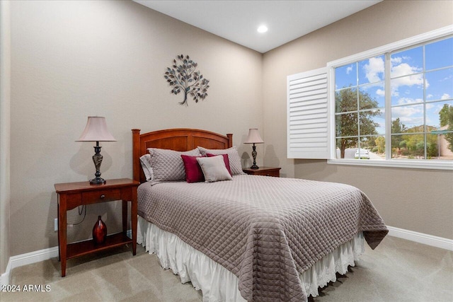 bedroom with light colored carpet