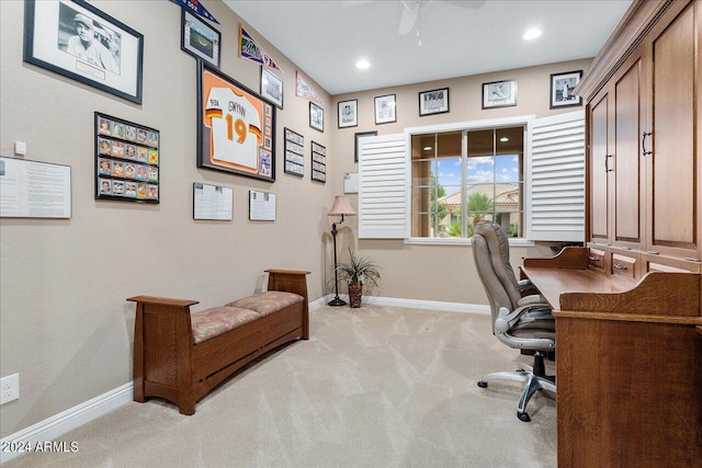 carpeted home office with ceiling fan