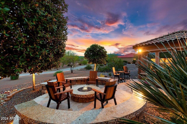 patio terrace at dusk with a fire pit