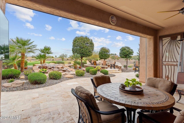 view of patio / terrace featuring ceiling fan