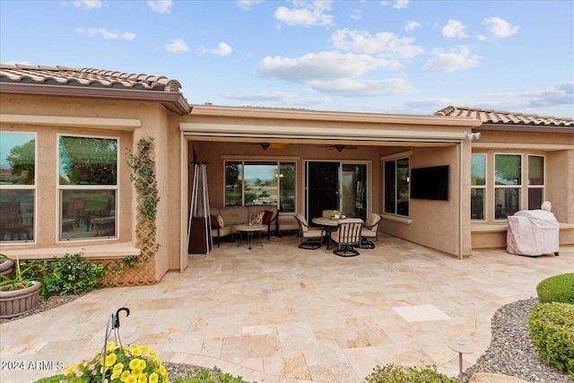 view of patio with an outdoor hangout area and ceiling fan