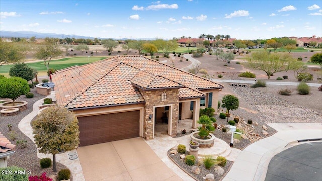 mediterranean / spanish-style house featuring a garage