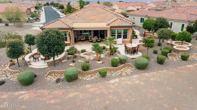 rear view of property with a patio area