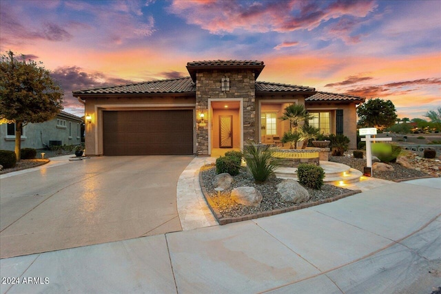 mediterranean / spanish-style house featuring a garage