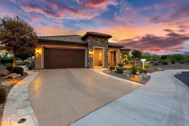 mediterranean / spanish-style home featuring a garage