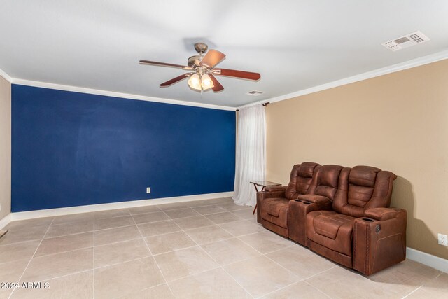 living area with light tile patterned floors and ornamental molding