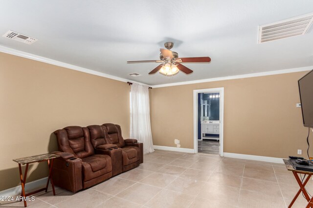 living room featuring crown molding, light tile patterned floors, and ceiling fan