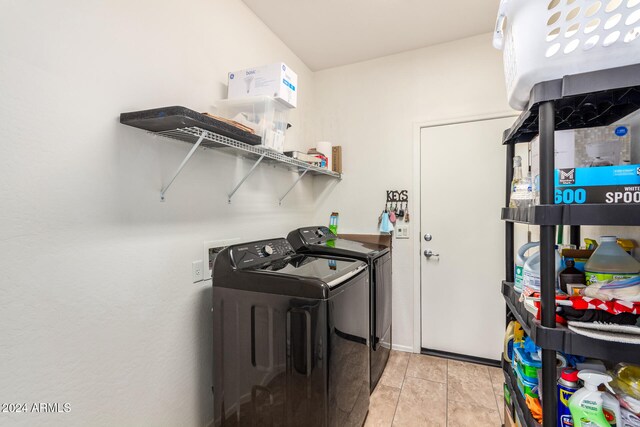 washroom featuring washer and dryer