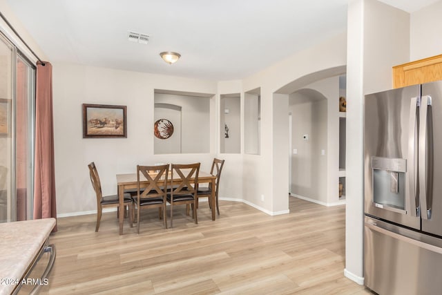 dining room featuring light wood-type flooring