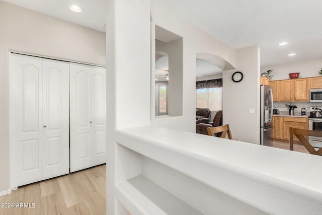 interior space featuring light hardwood / wood-style floors and stainless steel appliances