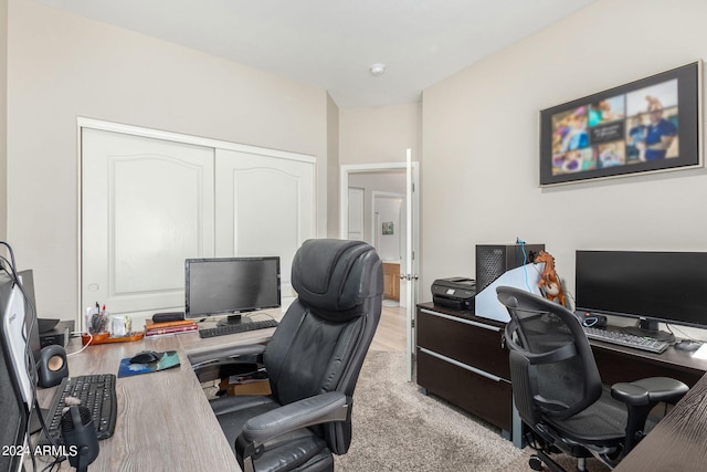 office with light wood-type flooring