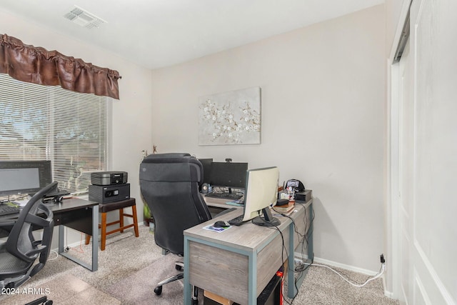 home office featuring light colored carpet