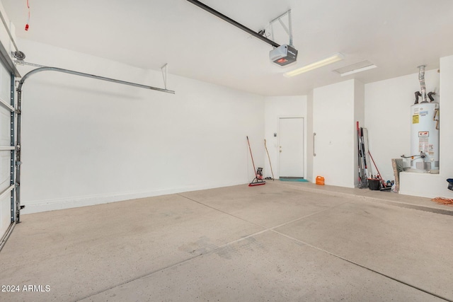 garage with a garage door opener and water heater