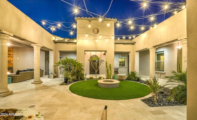 exterior space with a fire pit