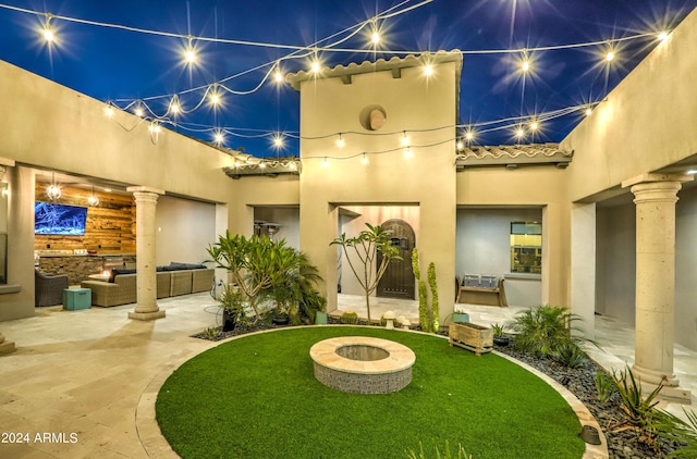 exterior space featuring an outdoor hangout area and a patio area