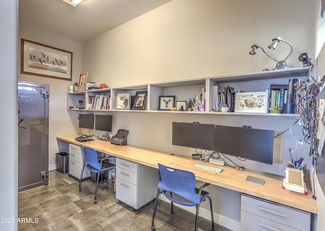 office featuring built in desk and baseboards