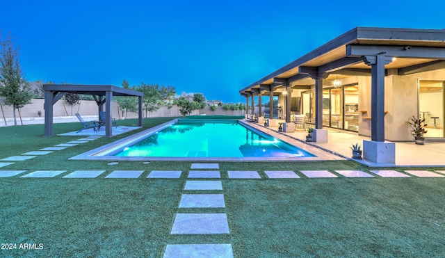 view of pool featuring a fenced in pool, a patio area, and a lawn