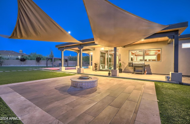 view of patio / terrace with a fire pit