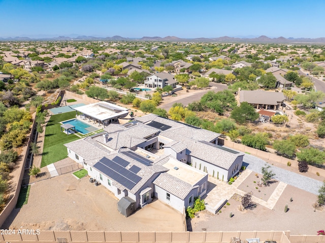 drone / aerial view featuring a residential view and a mountain view