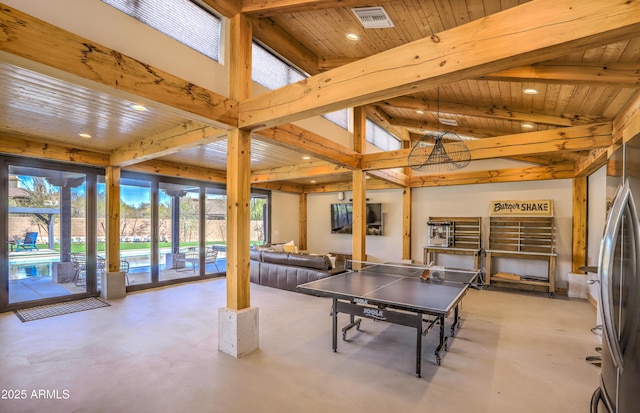 playroom with finished concrete flooring, beamed ceiling, and wood ceiling