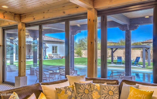 doorway to outside with wood ceiling