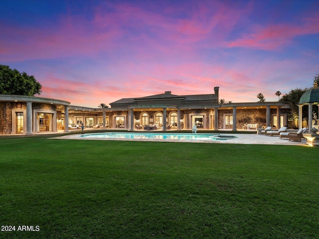 40 Biltmore Est, Phoenix, AZ 85016 - back of house featuring an outdoor pool, a yard, a patio, and a chimney