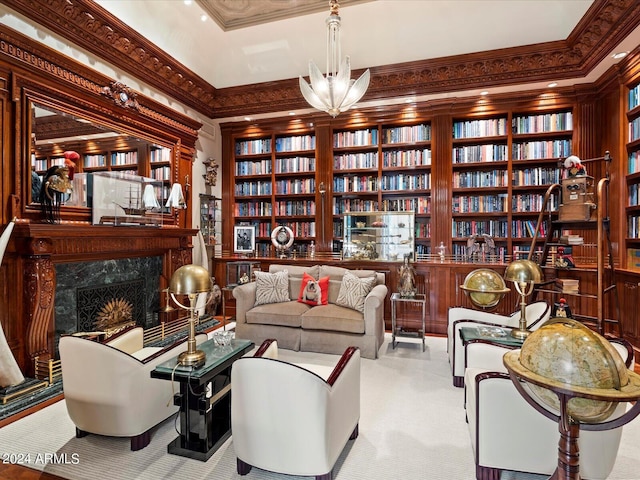 40 Biltmore Est, Phoenix, AZ 85016 - living area with wall of books, a premium fireplace, carpet, and ornamental molding