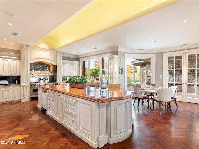 40 Biltmore Est, Phoenix, AZ 85016 - kitchen with visible vents, french doors, crown molding, and light stone countertops
