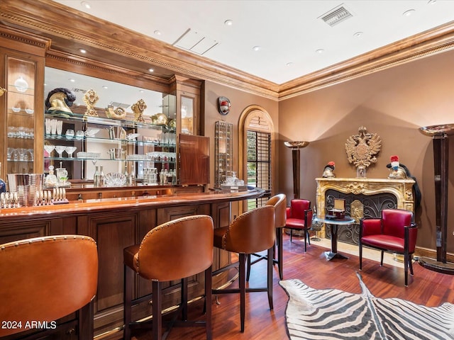 40 Biltmore Est, Phoenix, AZ 85016 - bar featuring visible vents, wood finished floors, a dry bar, and crown molding