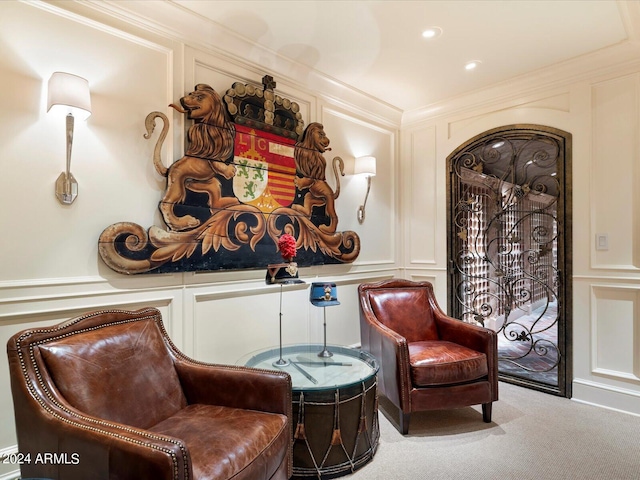 40 Biltmore Est, Phoenix, AZ 85016 - sitting room featuring carpet floors, crown molding, and a decorative wall