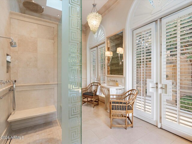 40 Biltmore Est, Phoenix, AZ 85016 - full bathroom featuring tile patterned flooring, a healthy amount of sunlight, crown molding, and a tile shower