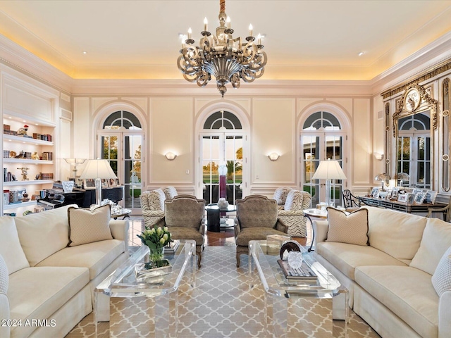 40 Biltmore Est, Phoenix, AZ 85016 - living area featuring built in shelves, crown molding, french doors, an inviting chandelier, and a decorative wall