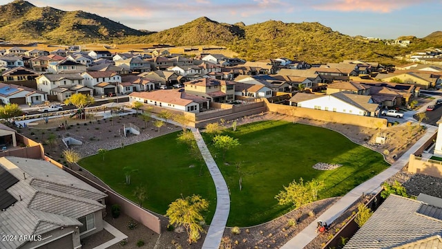 aerial view at dusk featuring a mountain view