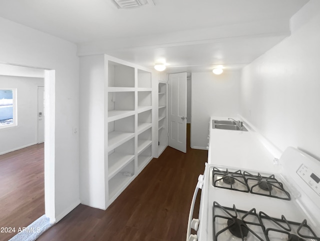 kitchen with hardwood / wood-style flooring, sink, and white range