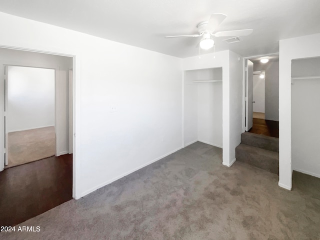 unfurnished bedroom featuring ceiling fan and carpet