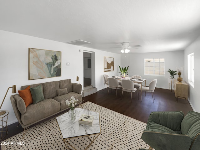 living room with ceiling fan and wood-type flooring