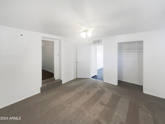 unfurnished bedroom featuring carpet flooring, ceiling fan, and a closet