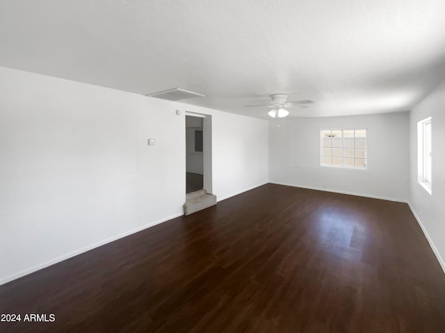 empty room featuring ceiling fan and hardwood / wood-style floors