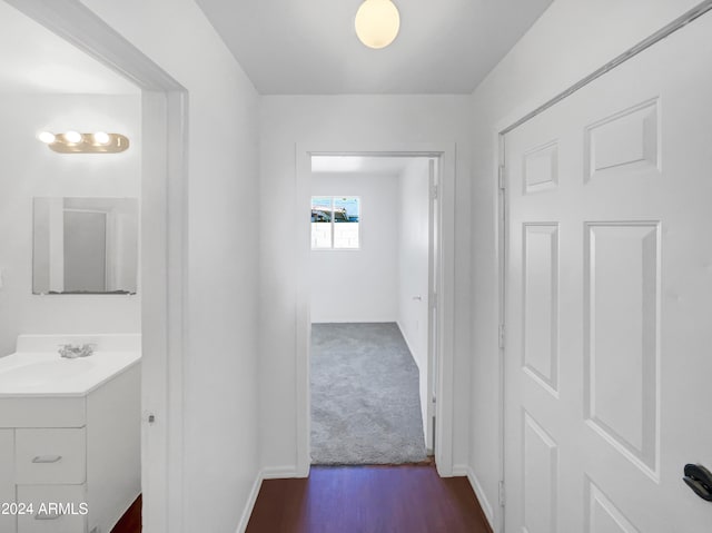 hall with sink and hardwood / wood-style floors