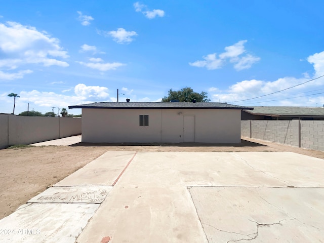 rear view of property featuring a patio