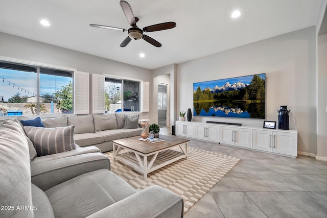 tiled living room featuring ceiling fan